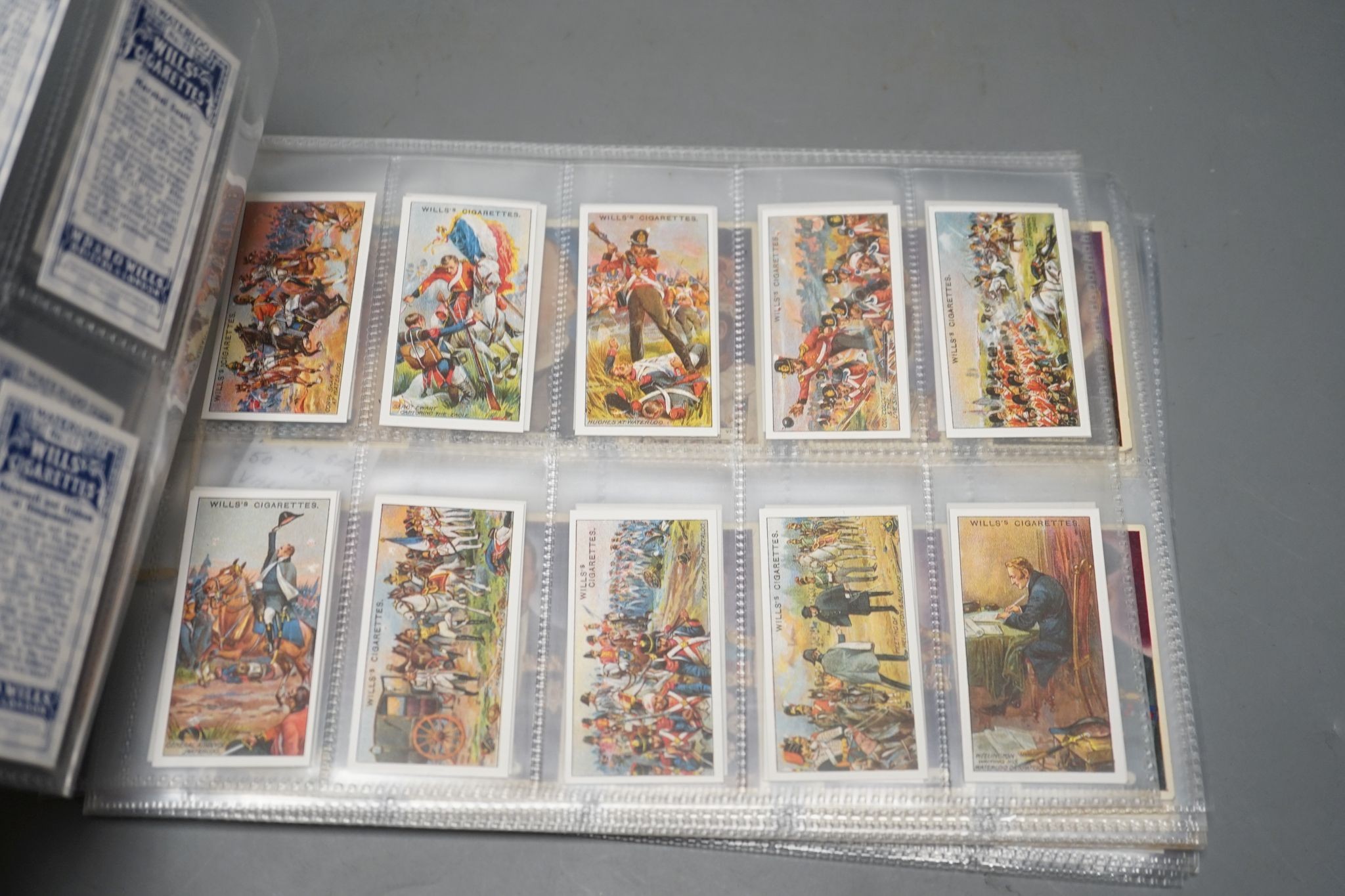 A large collection of pre and post war cigarette cards, in two albums, mounted in a plastic sheets and loose